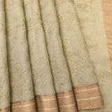 Light Mint Green Sheer Organza Saree With Magenta Floral Clusters And Woven Gold Zari Border