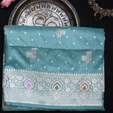 Teal Banarasi Silk Saree With Silver Zari Butti Body And Contrast Paisley Border
