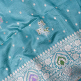 Teal Banarasi Silk Saree With Silver Zari Butti Body And Contrast Paisley Border