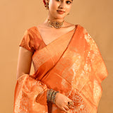 Vibrant Orange Banarasi Silk Saree With Floral Butti And Highlighted Border