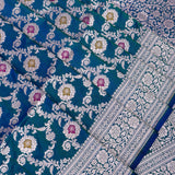 Peacock Teal Banarasi Silk Saree With Silver Zari Jaal Weave And Contrast Blue Pallu