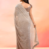 Brown Metallic Shimmer Net Saree With Elegant Beaded Tassels Blouse
