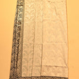 Beige Banarasi Silk Saree With Silver Zari Floral Jaal And Black Contrast Border