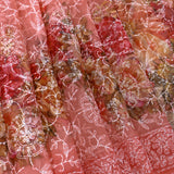 Peach-Coral Floral Printed Organza Saree With Embroidered Border