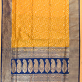 Sunshine Yellow And Royal Blue Silver Zari Floral Jaal Pure Silk Banarasi Saree With Paisley Pallu And Striped Border