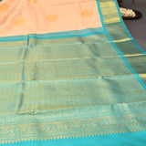 Peach And Teal Kanjivaram Silk Saree With Gold Zari Buttis And Diamond Trellis Border
