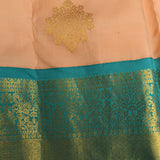 Peach And Teal Kanjivaram Silk Saree With Gold Zari Buttis And Diamond Trellis Border