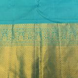 Peach And Teal Kanjivaram Silk Saree With Gold Zari Buttis And Diamond Trellis Border