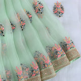 Mint Green Organza Saree With Multicolour Floral Butti & Heavy Gold Zardozi Embroidered Border