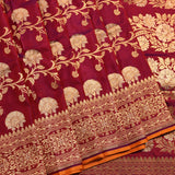 Maroon Gold Zari All Over Floral Jaal Pure Silk Banarasi Saree With Heavy Zari Border And Orange Accent