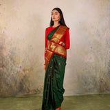 Dark Green Kanjivaram Silk Saree With Red Contrast Border & Gold Zari Buttas