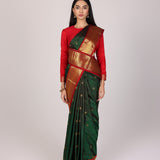 Dark Green Kanjivaram Silk Saree With Red Contrast Border & Gold Zari Buttas