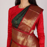 Dark Green Kanjivaram Silk Saree With Red Contrast Border & Gold Zari Buttas