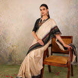 Cream Woven Tussar Silk Saree With Contrast Black Temple Border