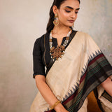 Cream Woven Tussar Silk Saree With Contrast Black Temple Border