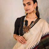 Cream Woven Tussar Silk Saree With Contrast Black Temple Border