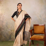 Cream Woven Tussar Silk Saree With Contrast Black Temple Border