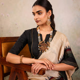 Cream Woven Tussar Silk Saree With Contrast Black Temple Border