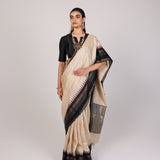 Cream Woven Tussar Silk Saree With Contrast Black Temple Border