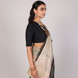 Cream Woven Tussar Silk Saree With Contrast Black Temple Border