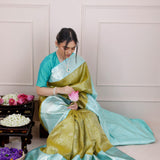 Olive Green Kanjivaram Silk Saree With Mayil Chakra And Floral Weaving