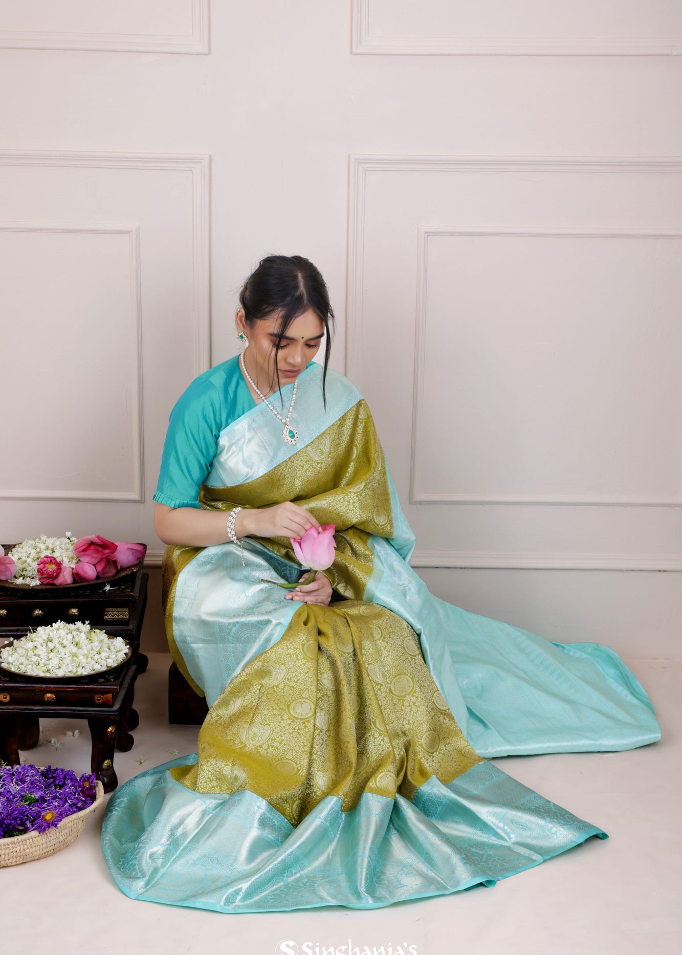 Olive Green Kanjivaram Silk Saree With Mayil Chakra And Floral Weaving