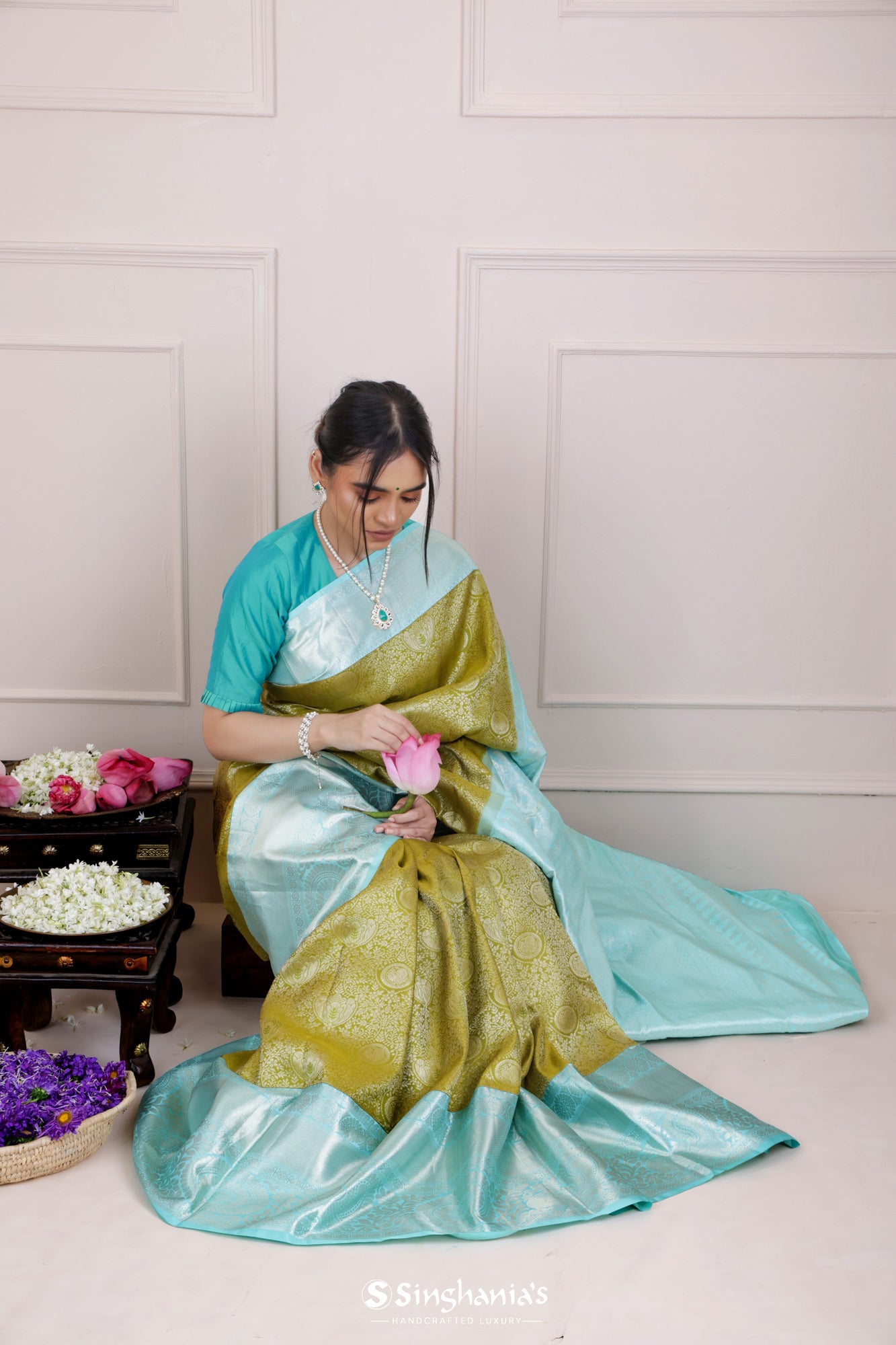 Olive Green Kanjivaram Silk Saree With Mayil Chakra And Floral Weaving