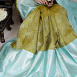 Olive Green Kanjivaram Silk Saree With Mayil Chakra And Floral Weaving