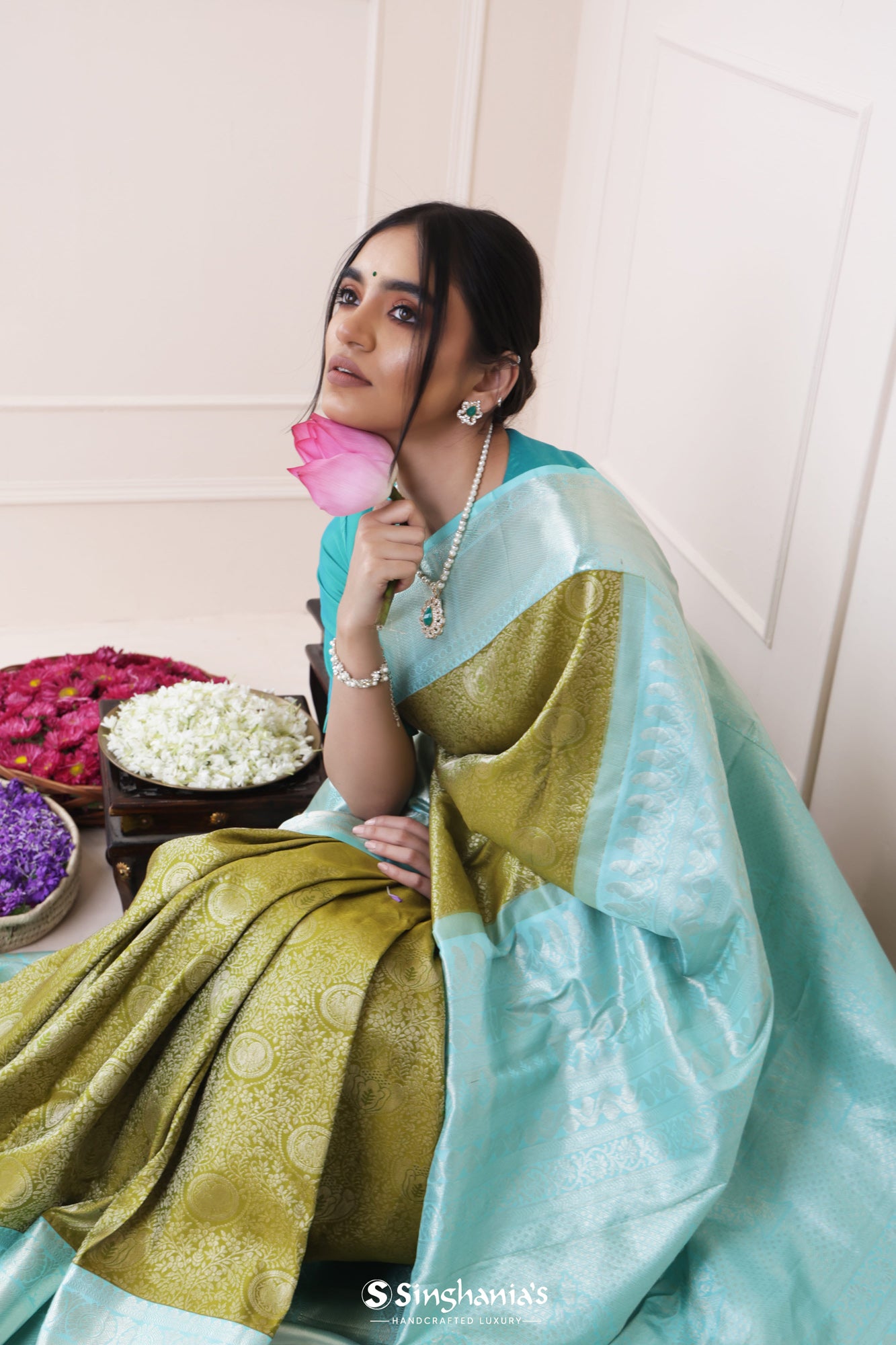 Olive Green Kanjivaram Silk Saree With Mayil Chakra And Floral Weaving