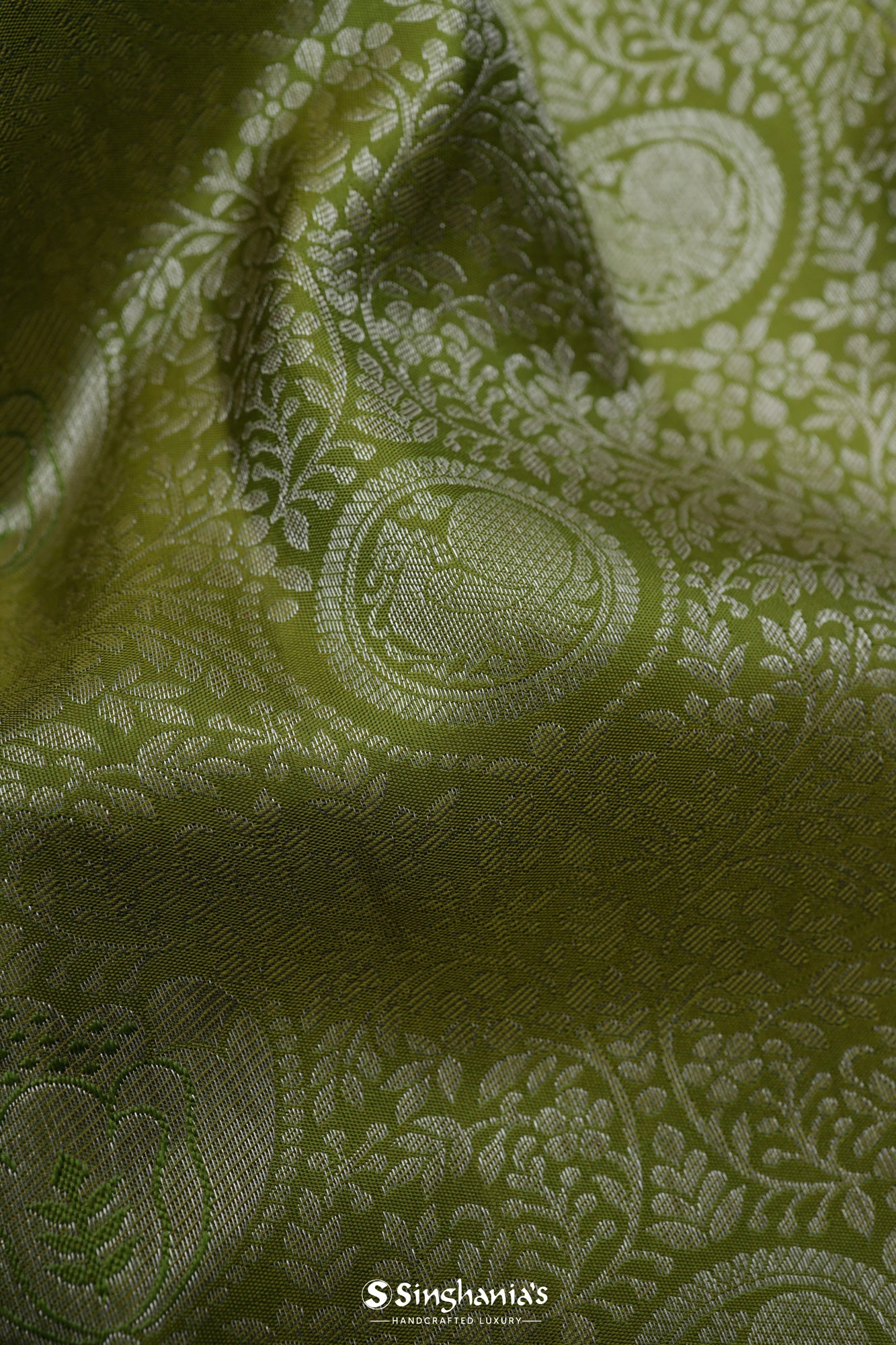 Olive Green Kanjivaram Silk Saree With Mayil Chakra And Floral Weaving